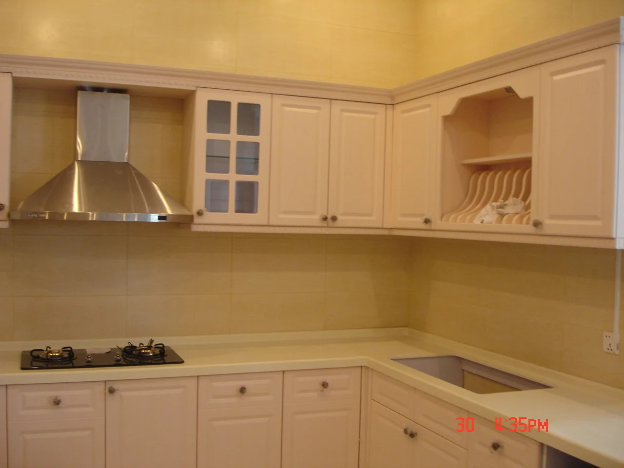 Cooking area and wall cabinets — Classic Kitchen in Southeast Asia